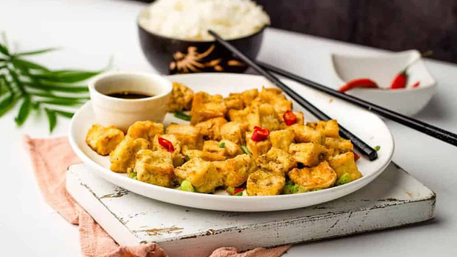 Air fried tofu on a white plate.