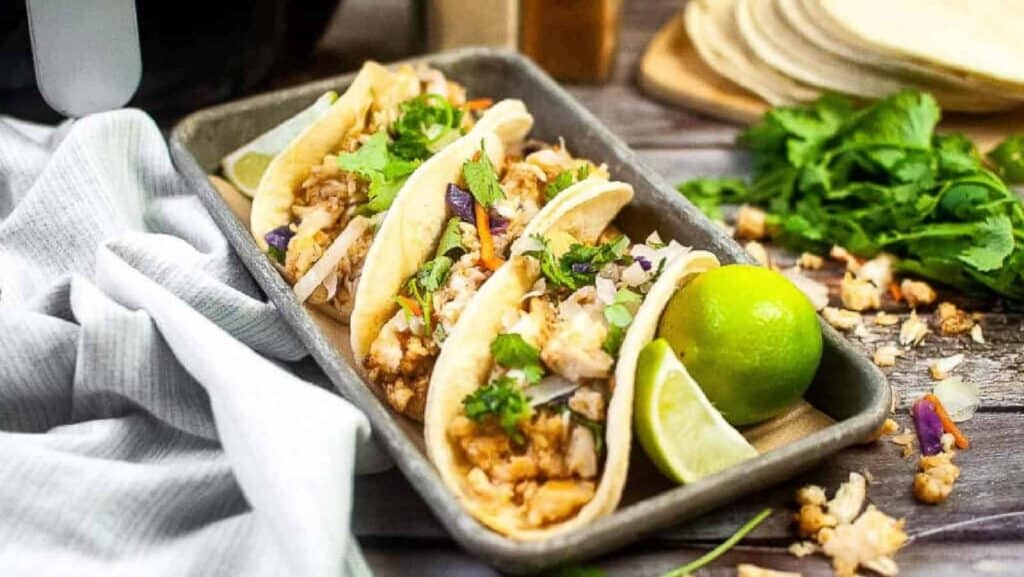 Fish tacos on a baking sheet.