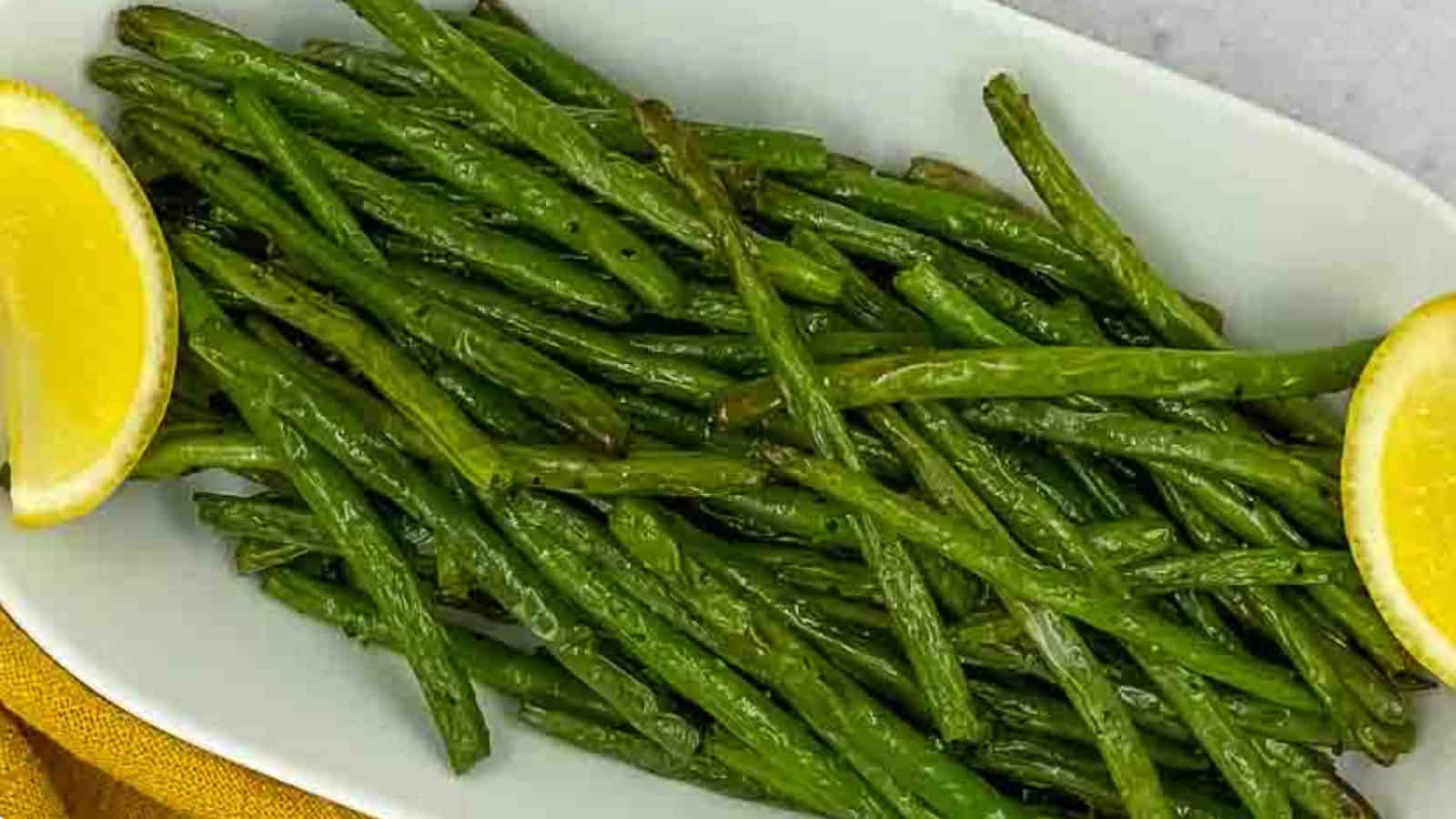 Air fried green beans on a yellow napkin.