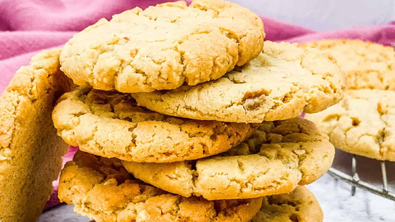 Peanut butter cookies stacked up on each other.