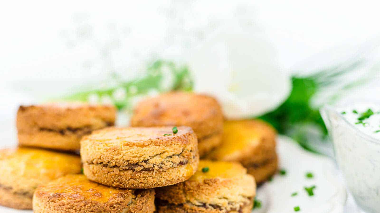 Almond Flour Biscuits on top of each other with chives.