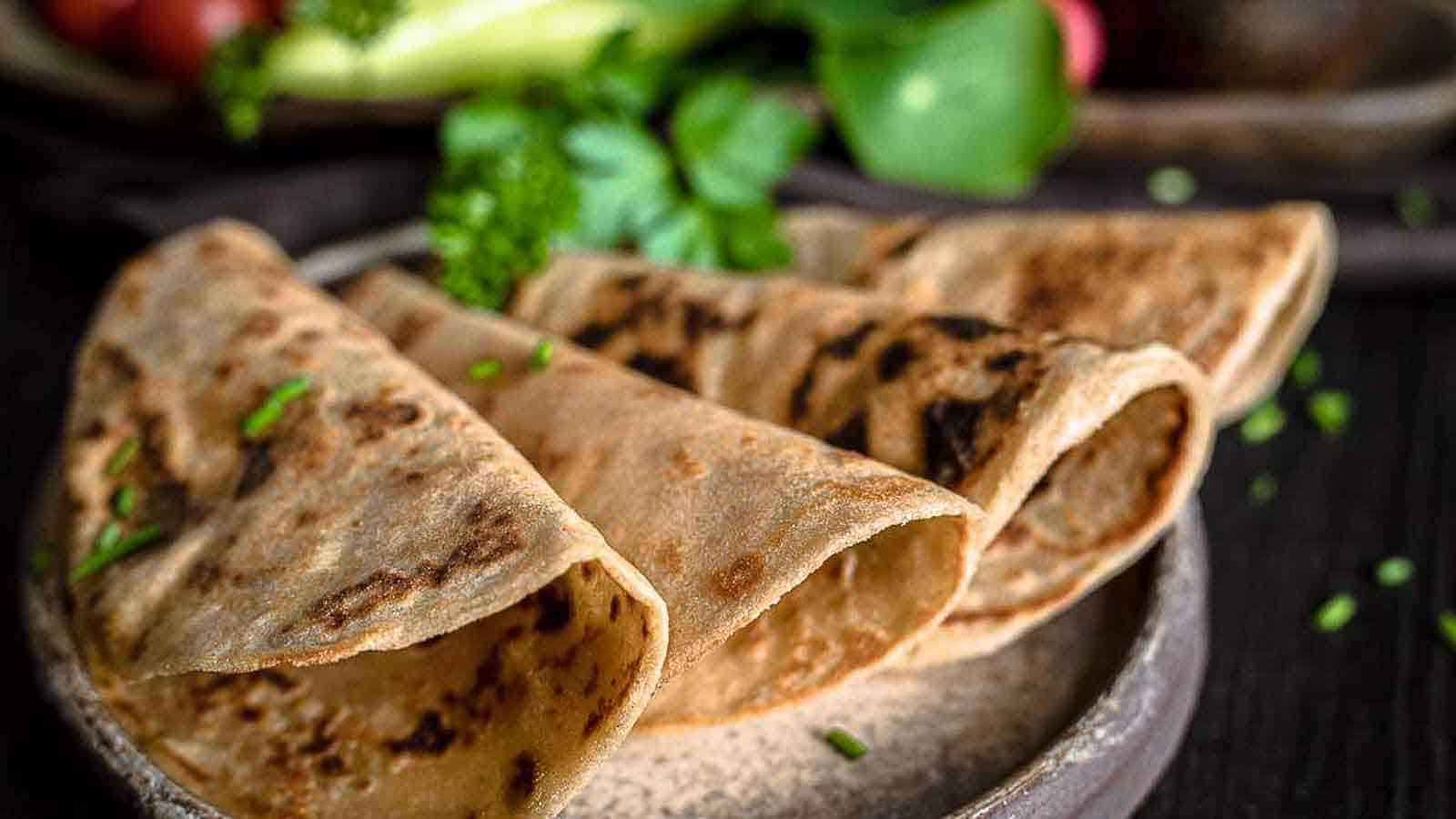 Fiber tortillas layered on a brown plate ready to consume. 