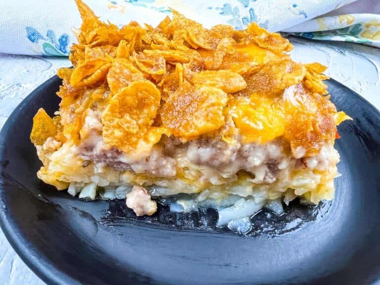 A plate of Eggless Breakfast Casserole with Sausage on a black plate.