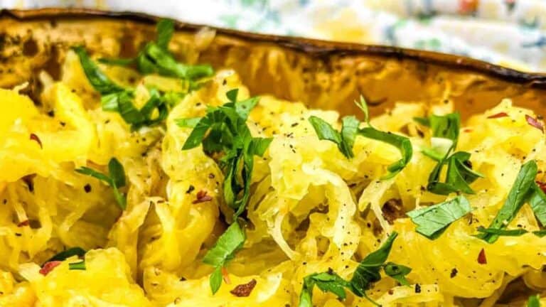 A dish of Smoked Spaghetti Squash with parsley and herbs.