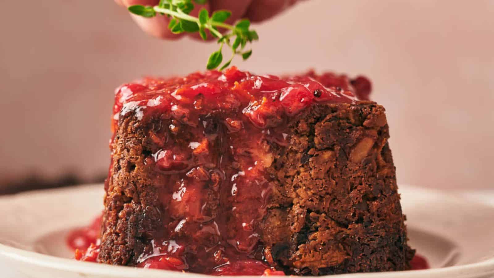 A plate with a nut roast and potatoes on it.