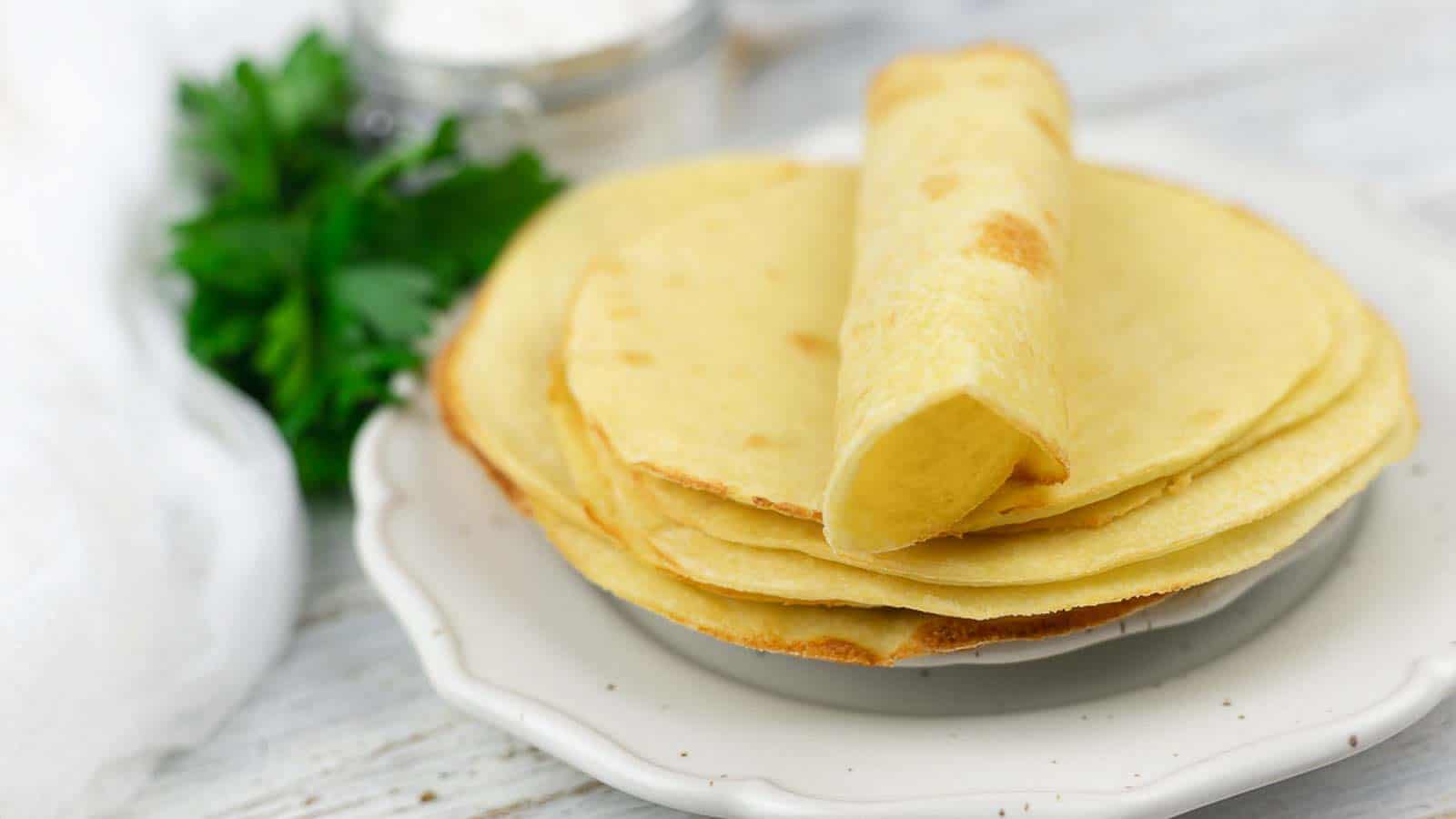 Keto Tortillas spread on a white plate ready to enjoy. 