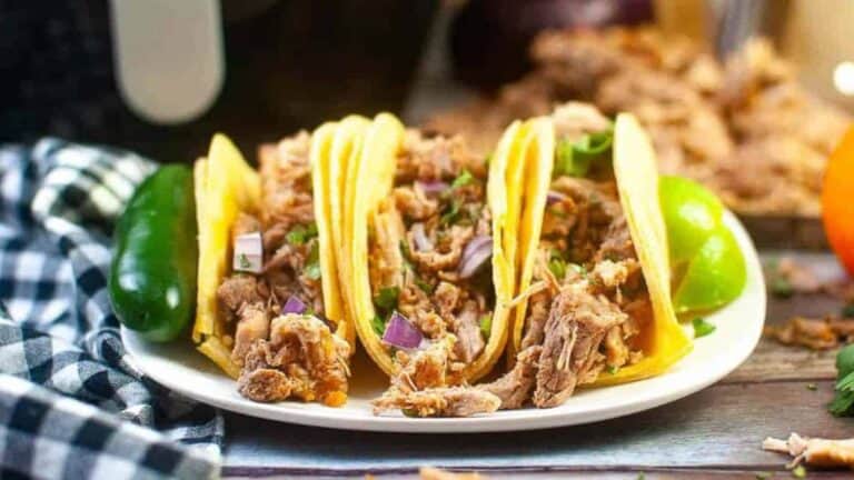 Carnitas tacos on a plate.