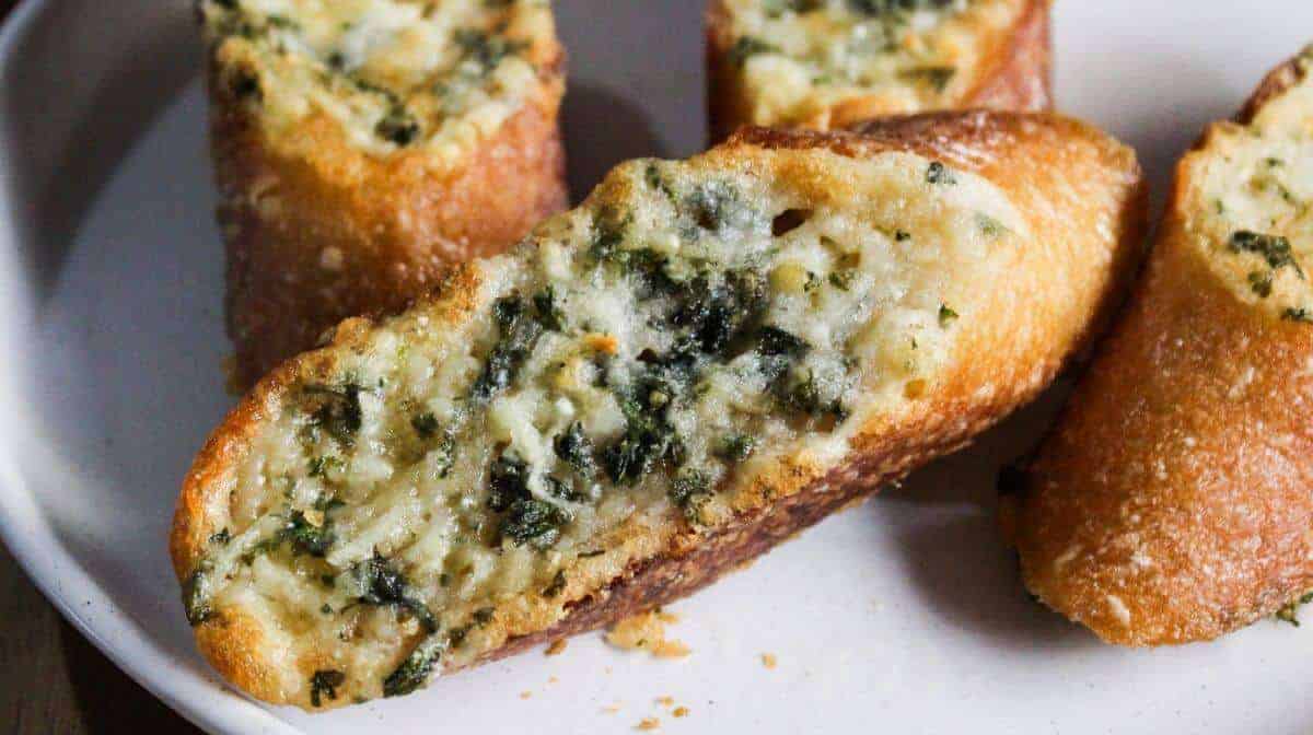 Air fryer garlic bread on white platter.