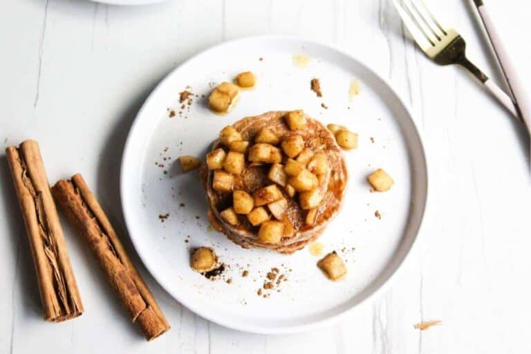 Pancakes with cinnamon and nuts on a plate.