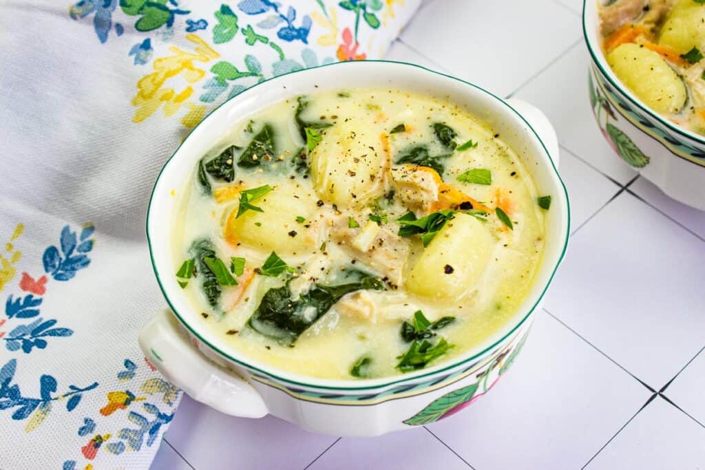 Two bowls of soup on a table.