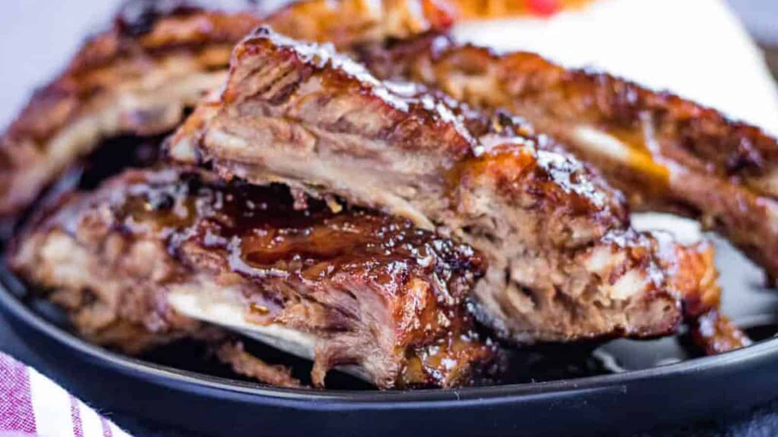 Low angle, closeup shot of spare ribs with hoisin glaze.