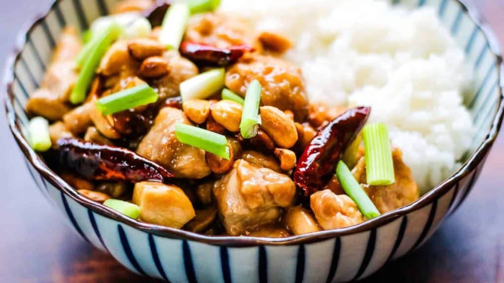 A bowl of chicken chilies and peanuts.