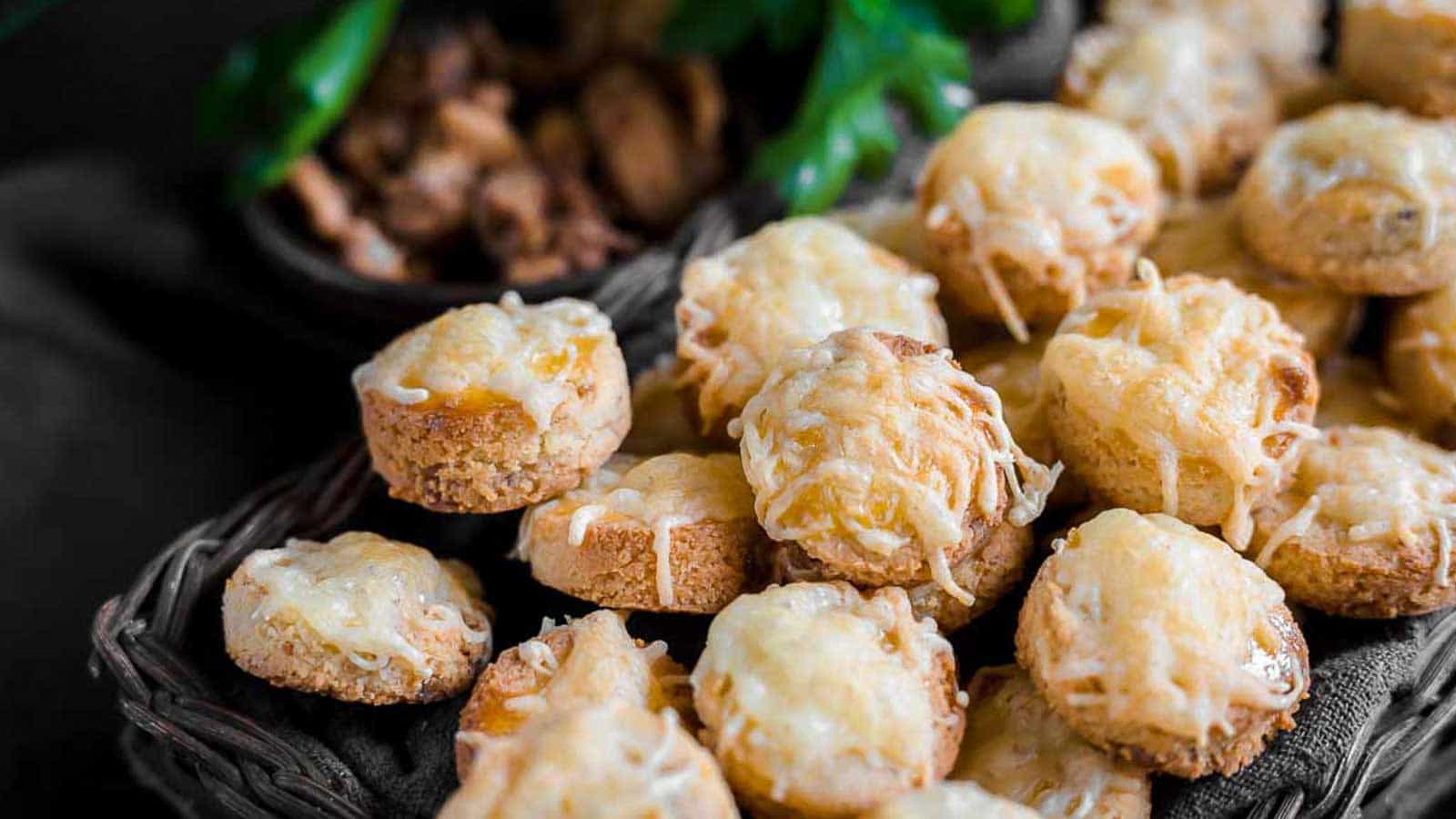 Cheesy bread bites in a basket ready for snacking. 