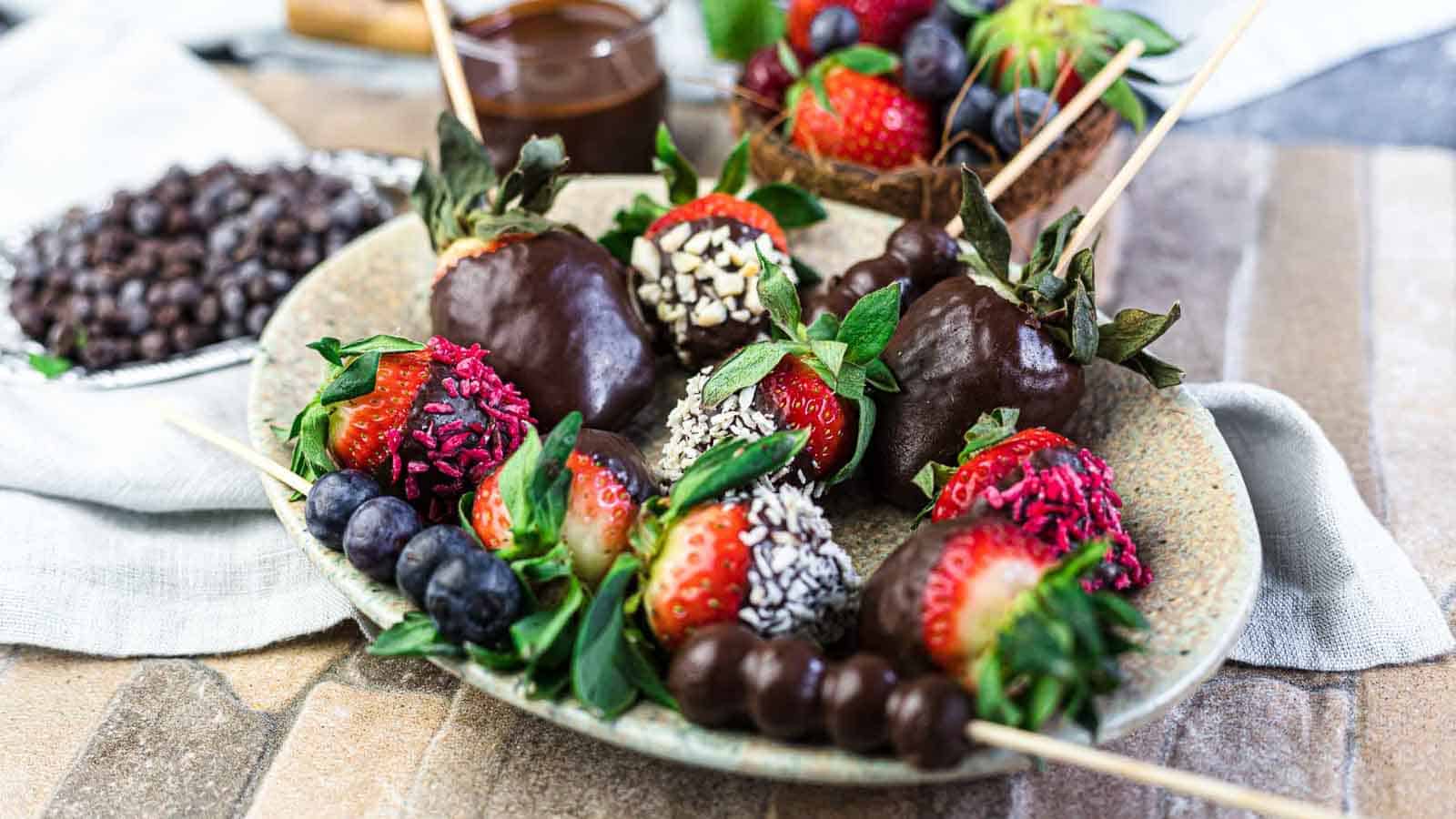 Chocolate Covered Strawberries and berries on a plate.