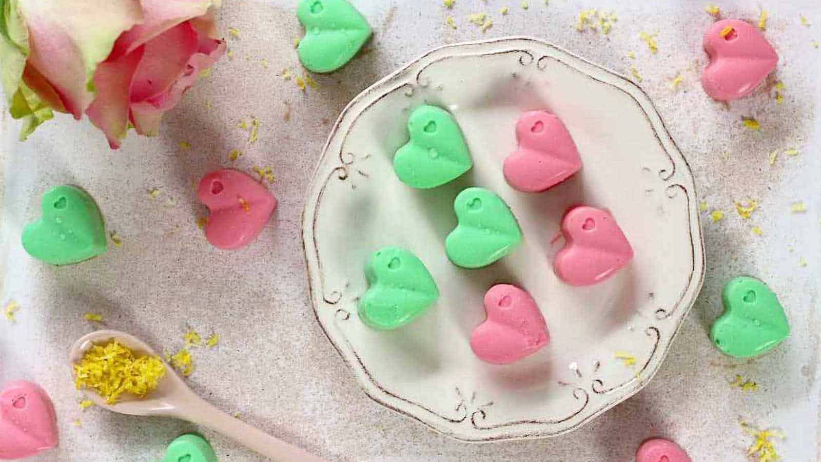 Cream Cheese Fat Bombs in green and pick on a plate and white board.