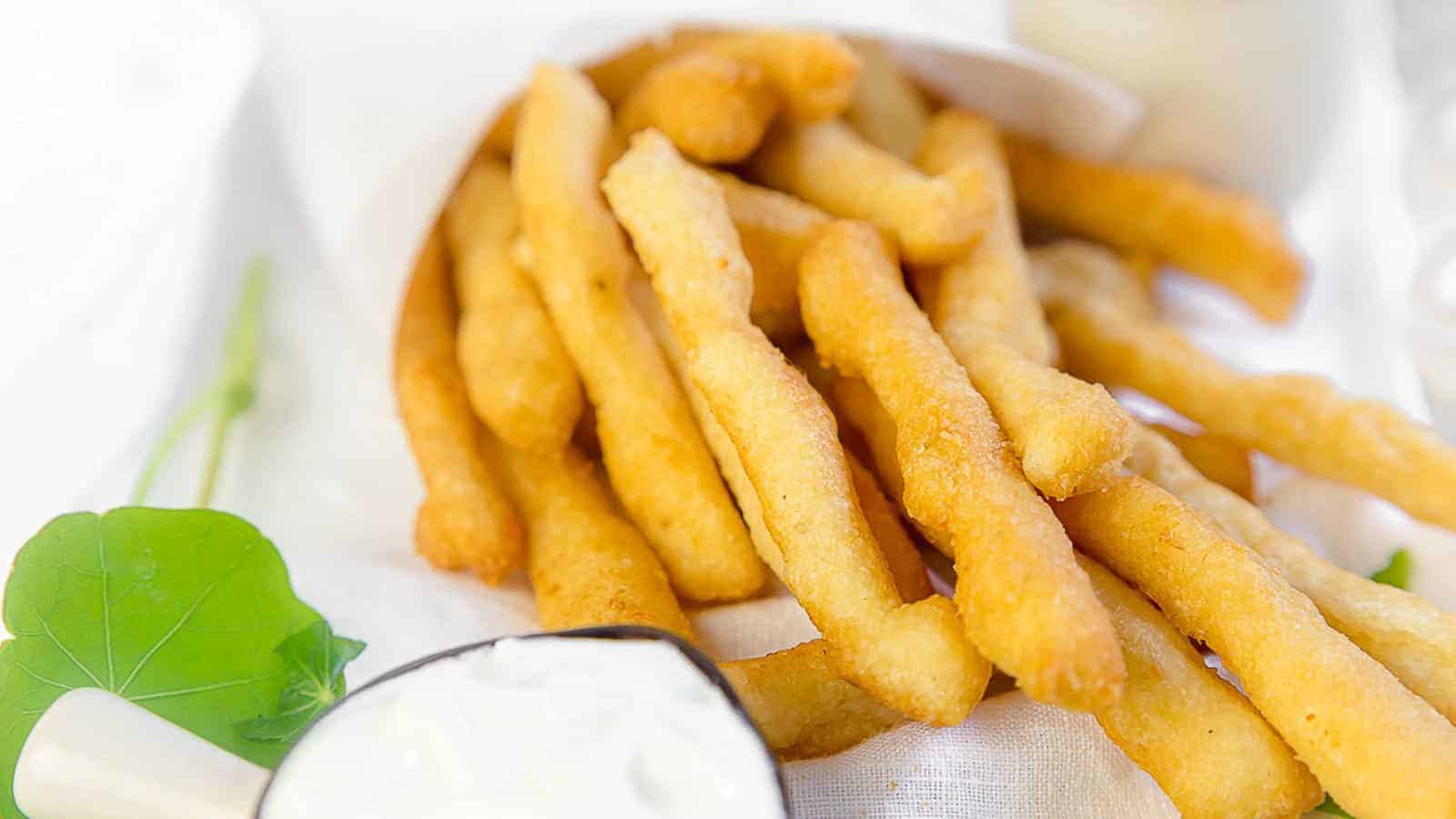 Keto French Fries on the table with ketchup and mayo. 