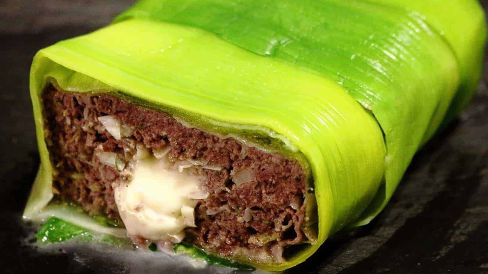 Meatloaf with green leek around it. 