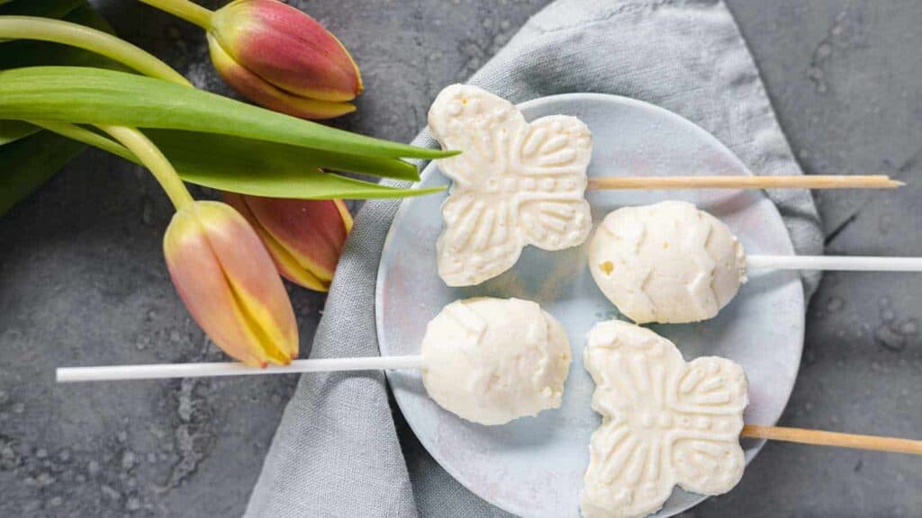 Mini Popscicles on a plate with tulips.