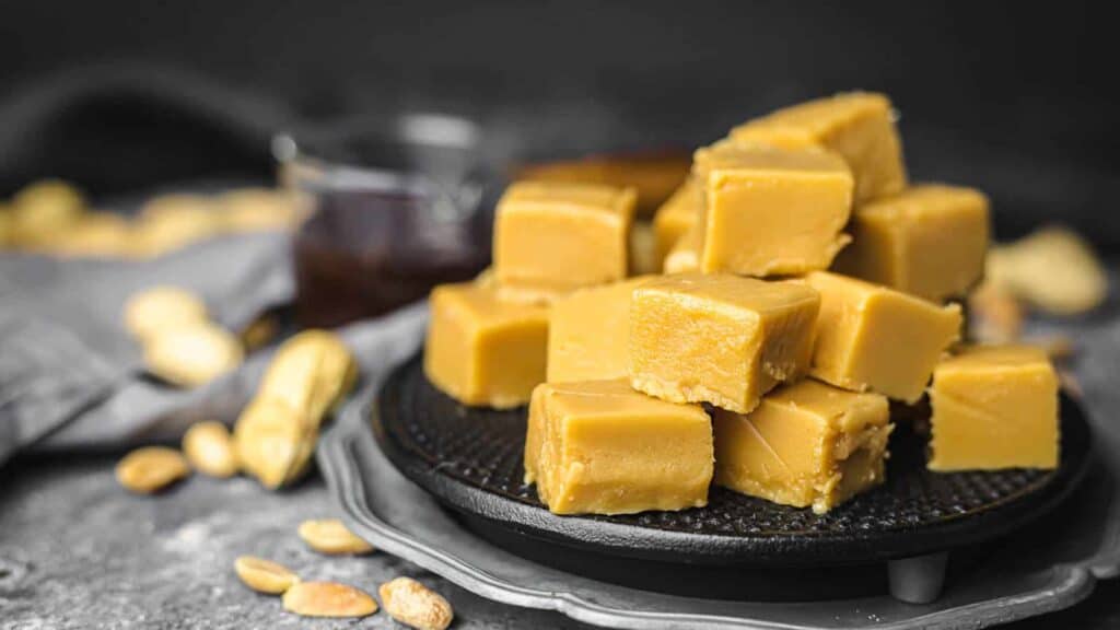 Peanut Butter Fudge on a black plate.