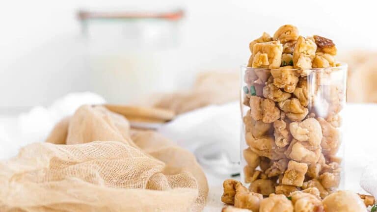 Crispy Pork Lard Scratchings inside a glass.