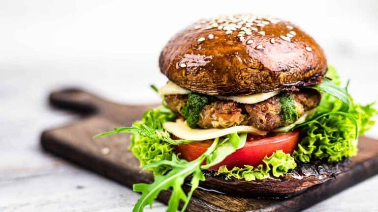 Portobello mushrooms buns with burger in between.