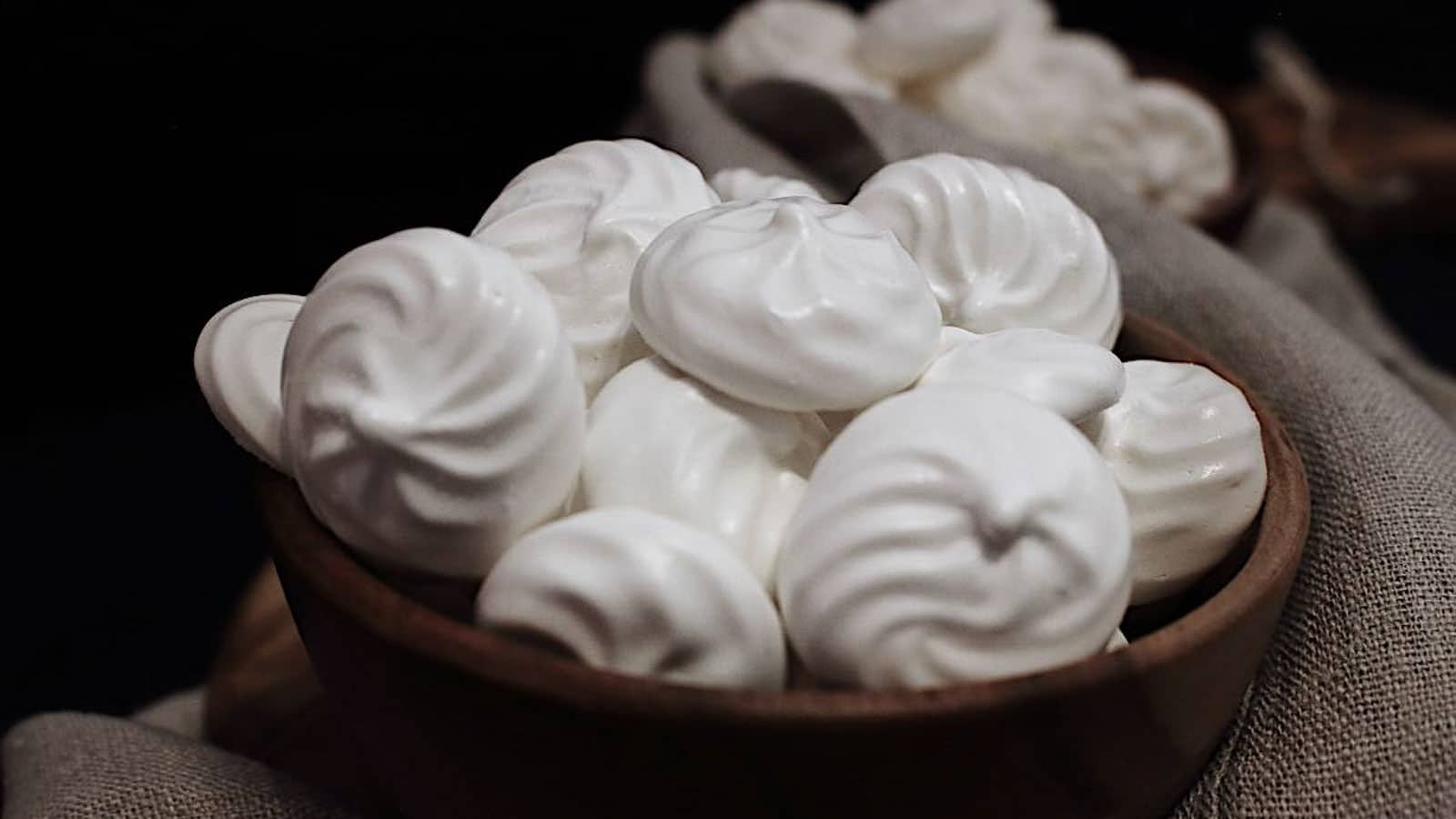 Sugar Free Keto Meringue Cookies in a dark bowl. 