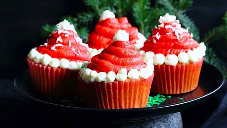 Santa Hats Cupcakes on a plate.