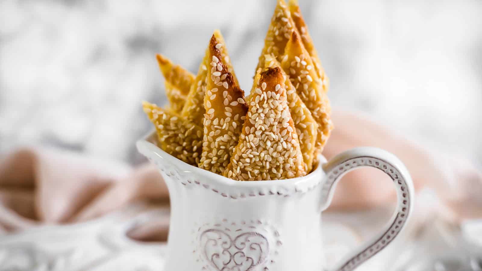 Sesame Keto Crackers in a white jug.