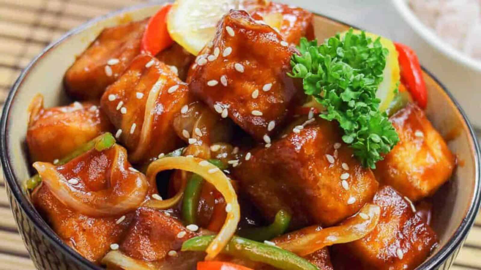 Low angle shot of a bowl of sweet and sour tofu.