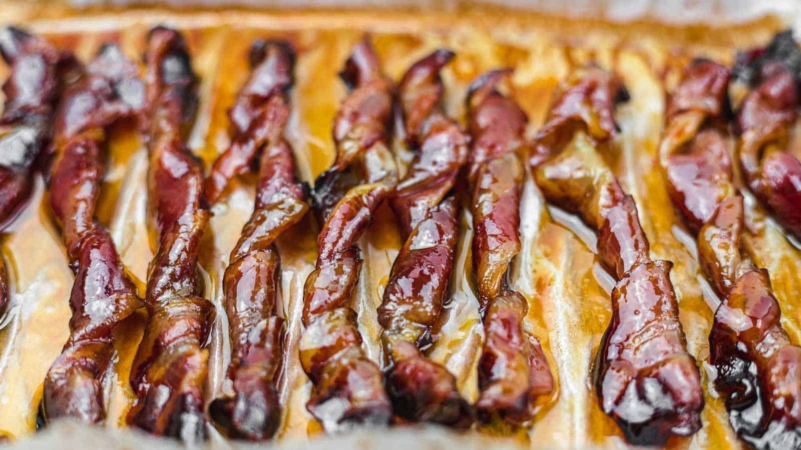 Candied Bacon Twists on a parchment paper. 