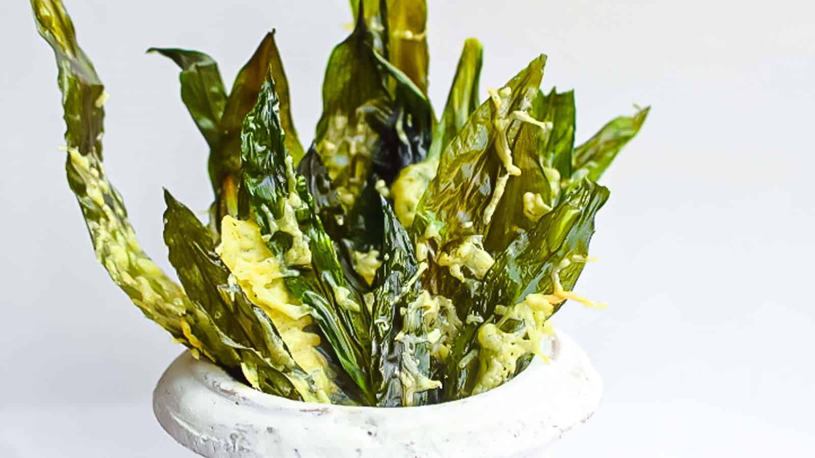 Wild Garlic Greens Chips in a pot with cheese. 