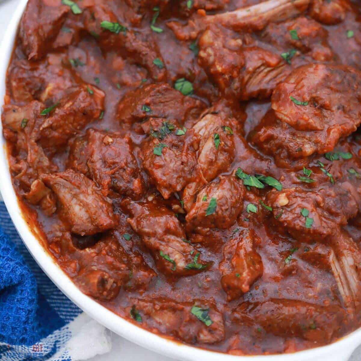 Braised beef short ribs in white bowl.