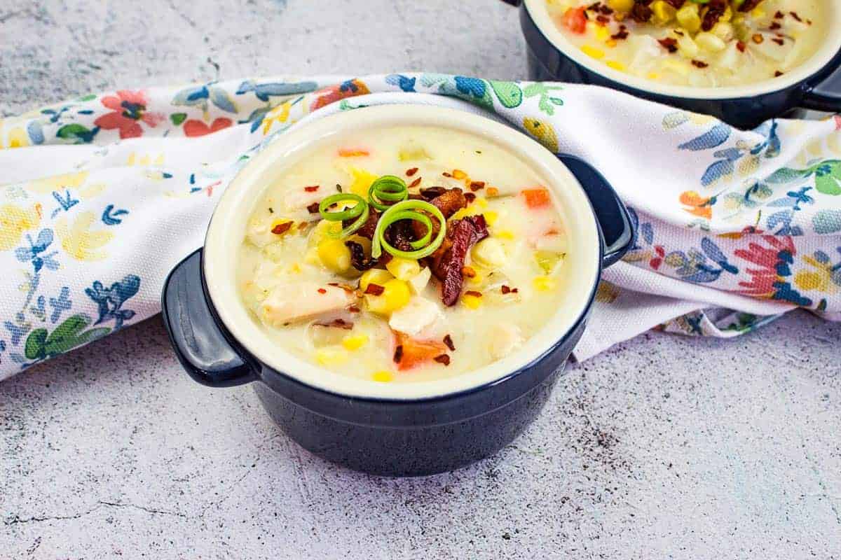 Two bowls of soup on a table.