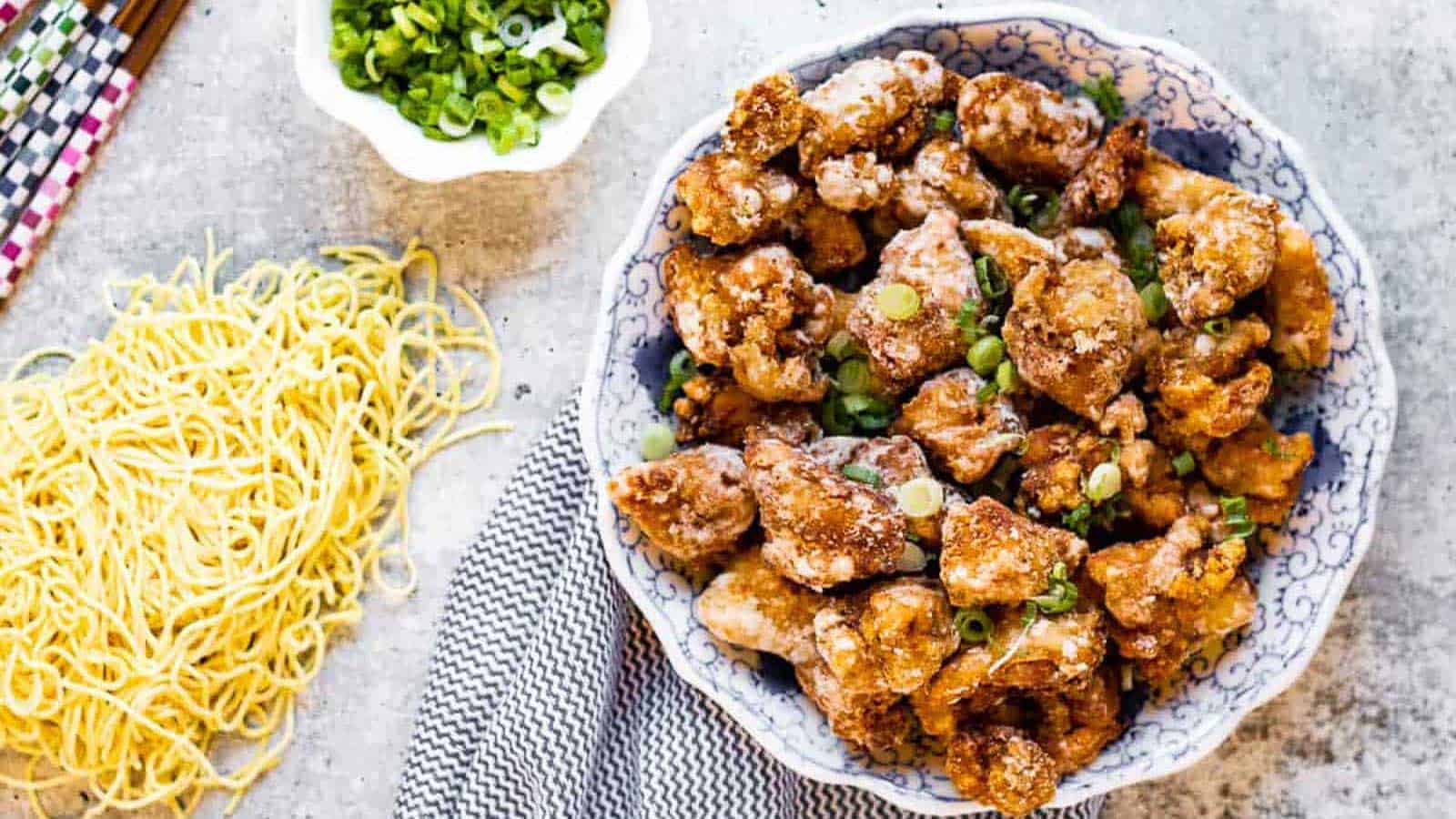 Overhead shot of karaage chicken with noodles on the side.