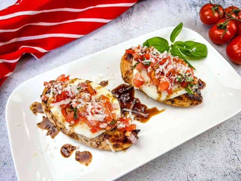 Grilled Bruschetta Chicken on a white plate.