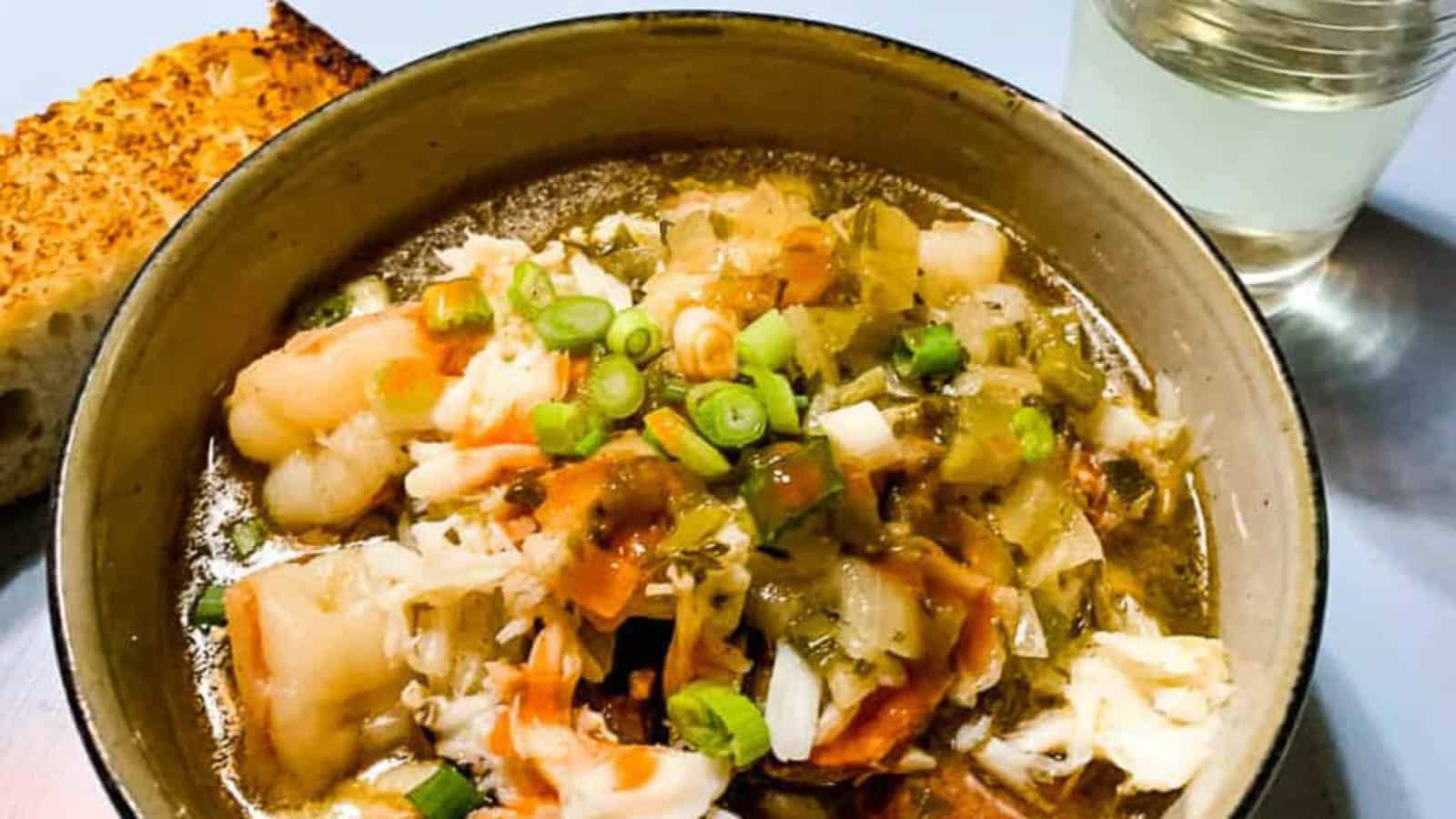 A bowl of crab, shrimp, and sausage gumbo.