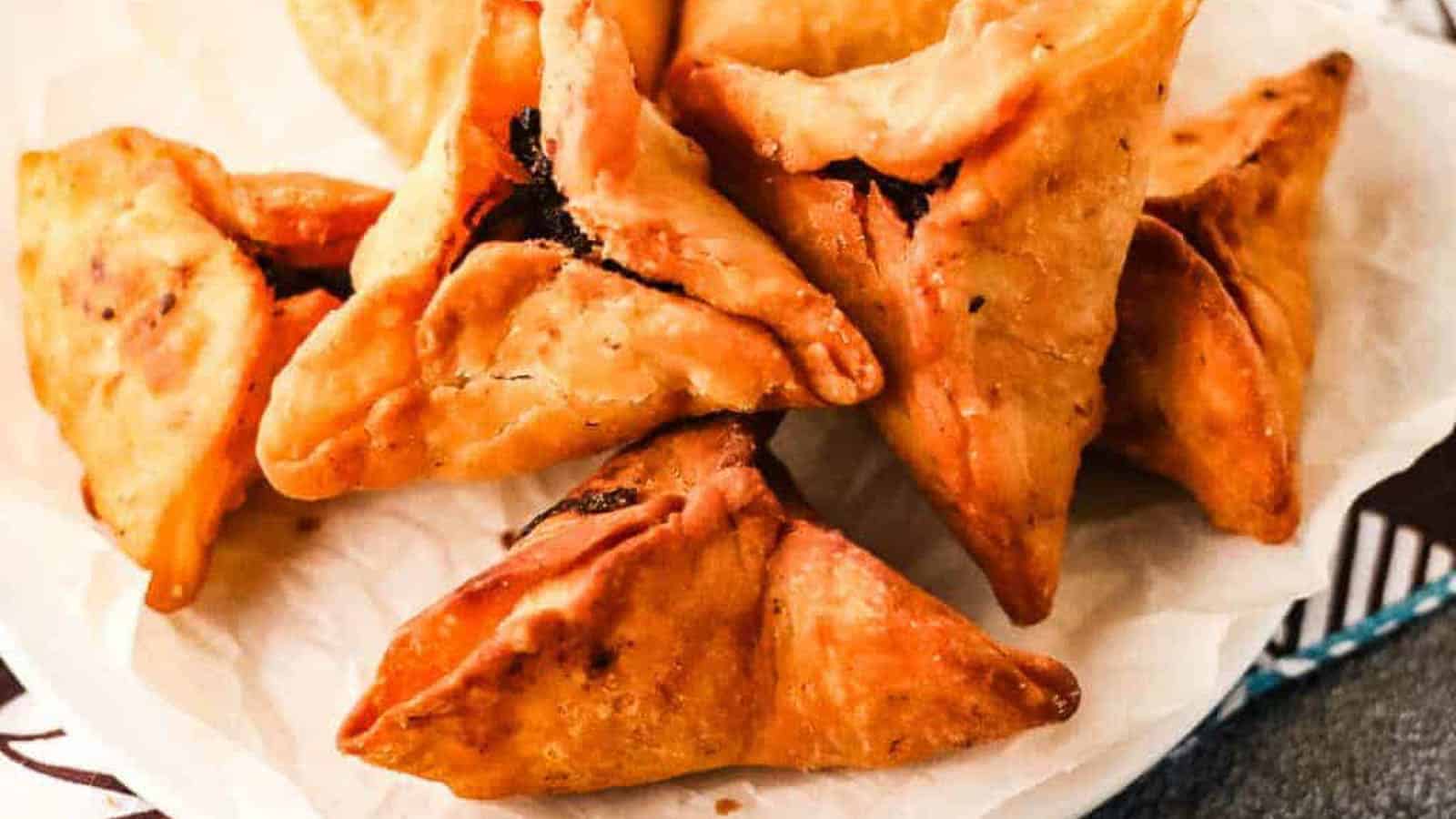 Low angle shot of fried onion samosas ready to serve.