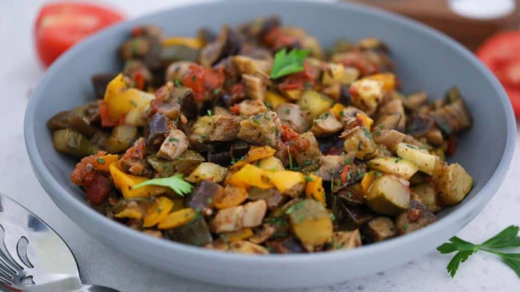 A blue Bowl of Vegan Ratatouille.