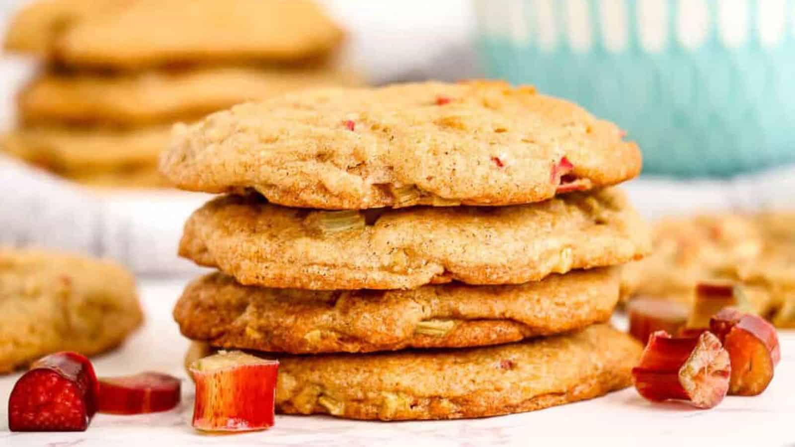 Stacked rhubarb cookies with slices of rhubarb.