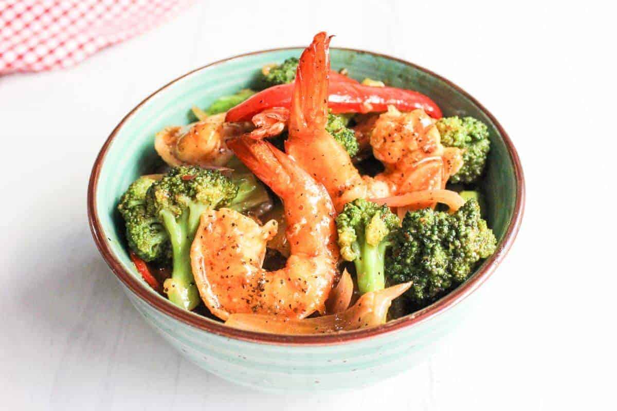 Shrimp and broccoli stir-fry in a bowl.