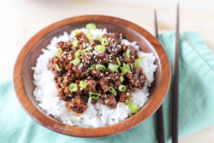 Close up photo of ground chicken in an asian sauce on white rice.