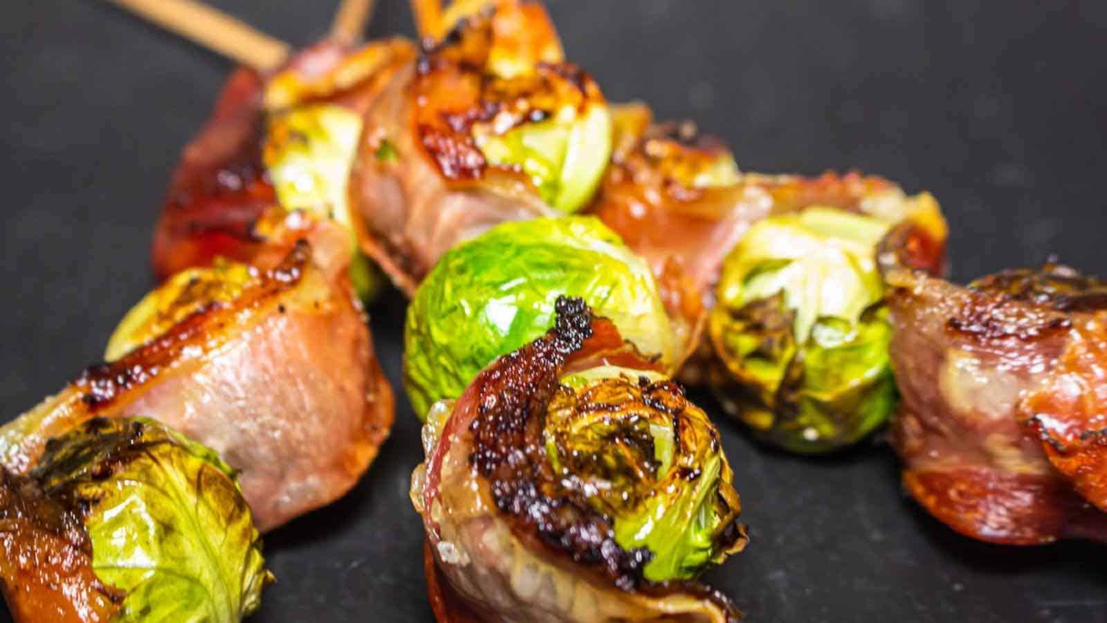 Bacon wrapped brussels sprouts on skewers.