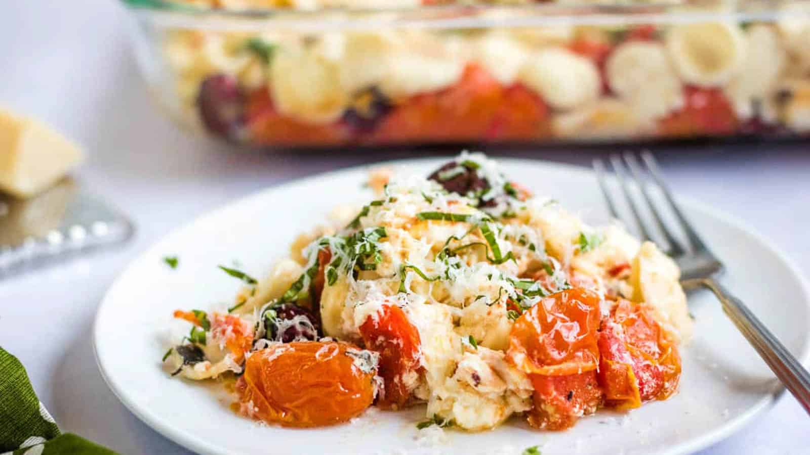 Baked feta pasta on a plate with a green napkin.