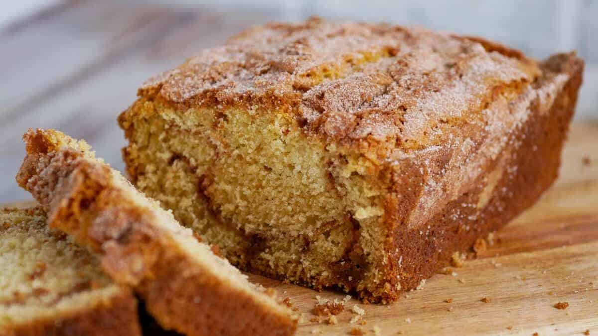 Loaf of cinnamon bread sliced to show the ribbon of cinnamon inside.