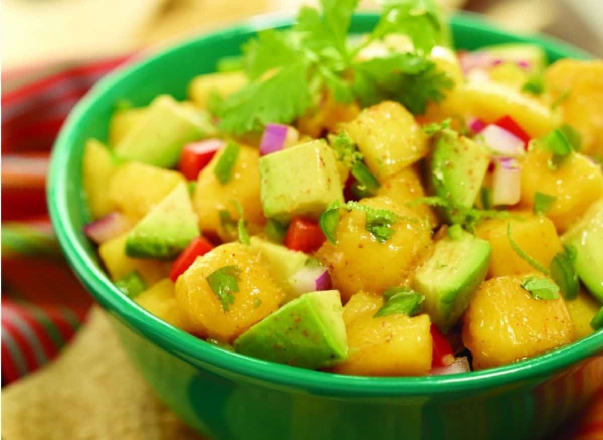 A bowl of avocado mango salsa.