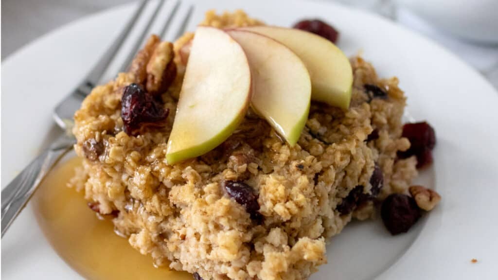 Baked Oatmeal with apples and cranberries on a plate.