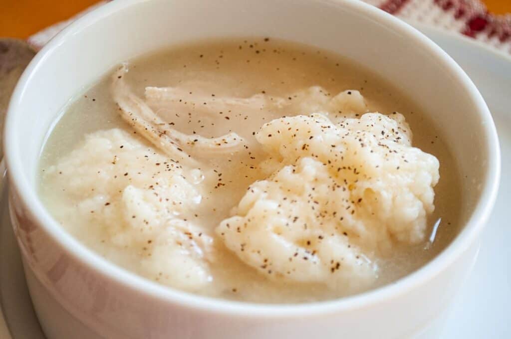 Enjoy a comforting bowl of soup, perfect for cozy winter dinners. This nourishing dish features delectable dumplings immersed in flavorful broth.