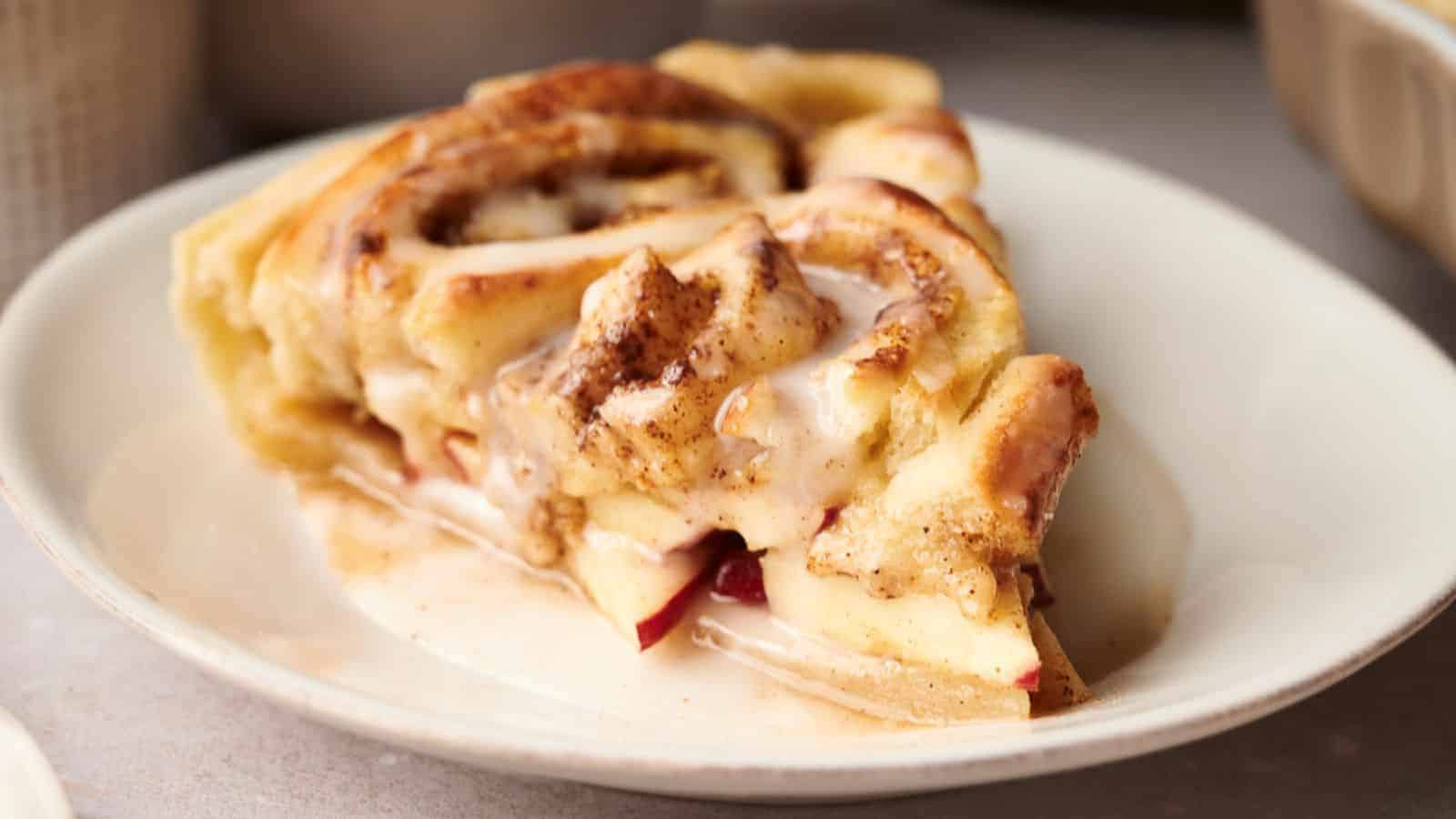 A slice of apple cinnamon roll on a plate.