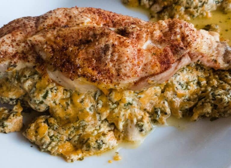 A picture of stuffed chicken breast with paprika.