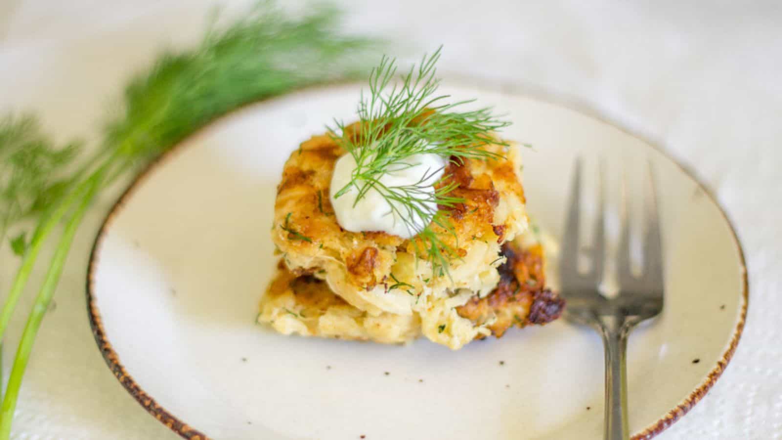 Overhead view of two fritters on plate.